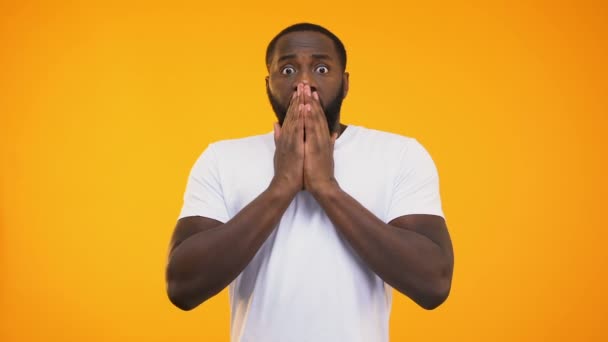 Young Surprised Black Man Closing His Mouth Hands Yellow Background — Stock Video