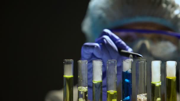 Chemist Checking Reaction Test Tubes Making Notes Secret Laboratory — Stock Video