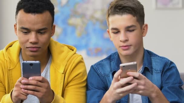 Two High Schoolers Browsing Dating Apps Smartphones Choosing Girlfriends — Stock Video