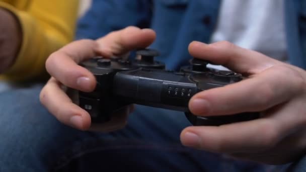 Two Young Males Playing Video Games Hands Pushing Joystick Buttons — Stock Video