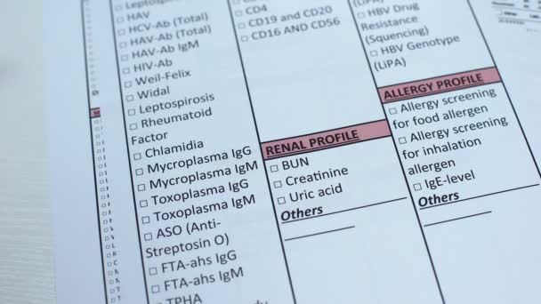 Creatinine, doctor checking name in lab blank, showing blood sample in tube — Stock Video