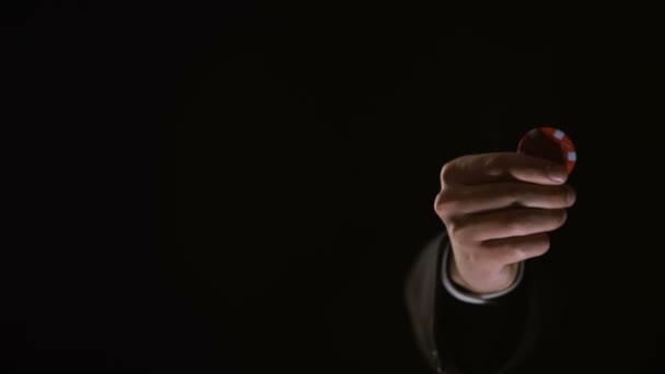 Business man rotating poker chip in hand and showing into camera, fortune — Stock Video