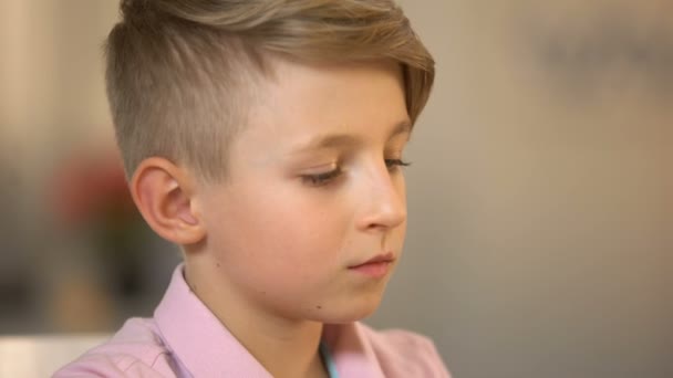 Male kid drinking milk beverage closeup, morning nutrition, health care, lactose — Stock Video