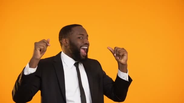 Cheerful black male in formalwear dancing celebrating promotion, salary increase — Stock Video