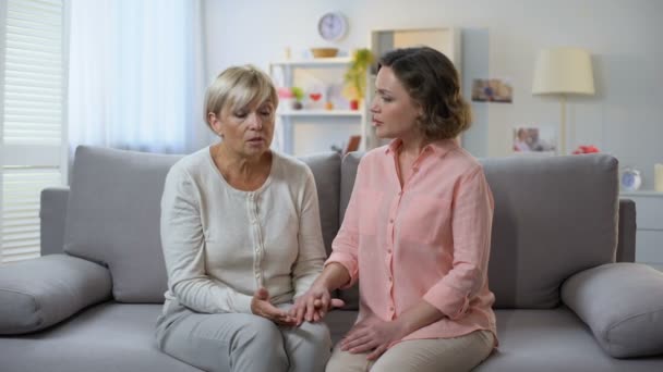 Daughter Comforting Elderly Mother Discussing Problem Support Care Help — Stock Video