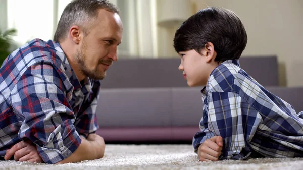 Boy Father Lying Floor Looking Each Other Making Contact Kid — Stock Photo, Image