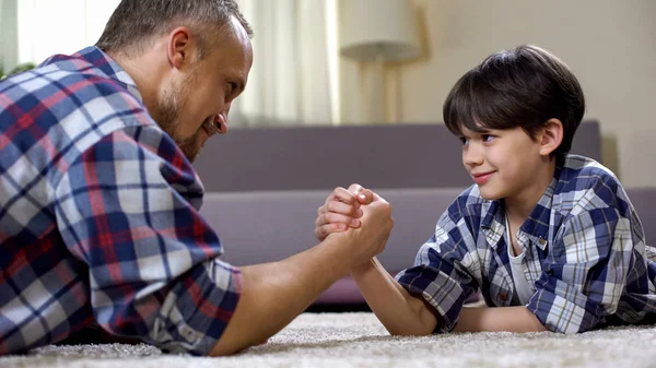 Little Male Kid Challenging His Father Arm Wrestling Having Fun — Stock Photo, Image