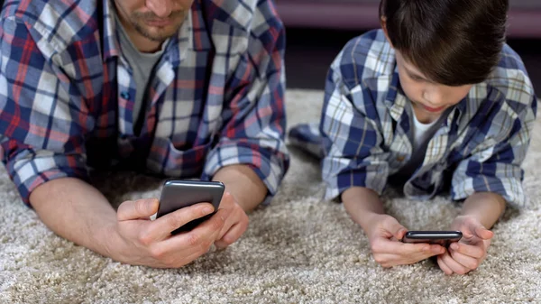 Son His Father Lying Floor Playing Smartphones Lack Care — Stock Photo, Image