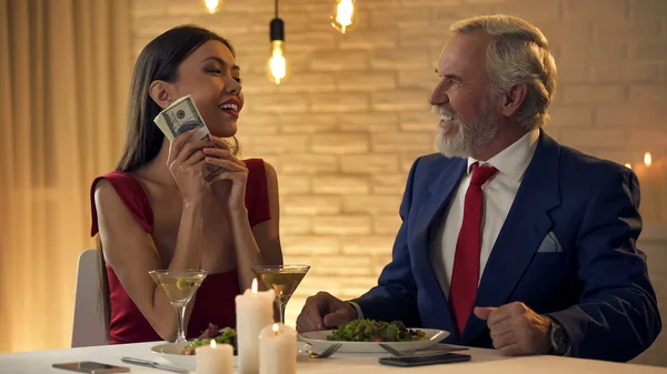 Beautiful Woman Holding Dollar Banknotes Having Date Rich Man Restaurant — Stock Photo, Image