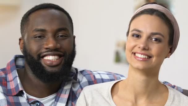 Smiling mixed-race couple preparing for spring-cleaning, traditions, close-up — Stock Video