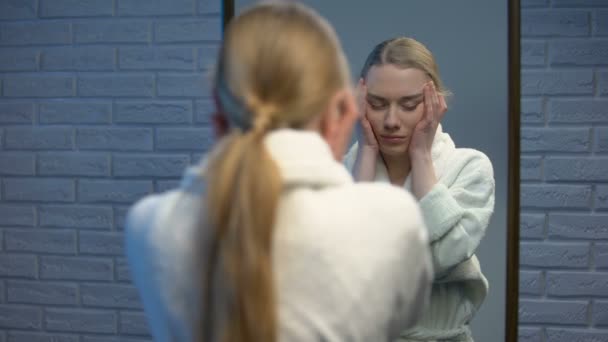 Depressed female in robe suffering stress looking in camera, soul pain, sorrow — Stock Video