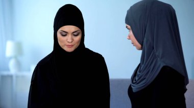 Arab woman comforting sad friend, unsuccessful marriage, friendship support clipart