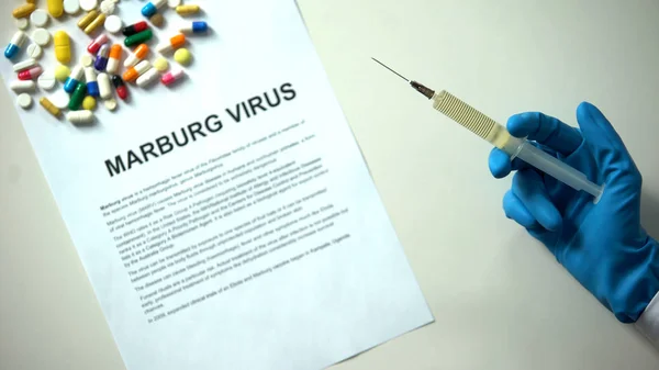 Marburg Virus Diagnosis Paper Hand Syringe Pills Tablets Table — Stock Photo, Image