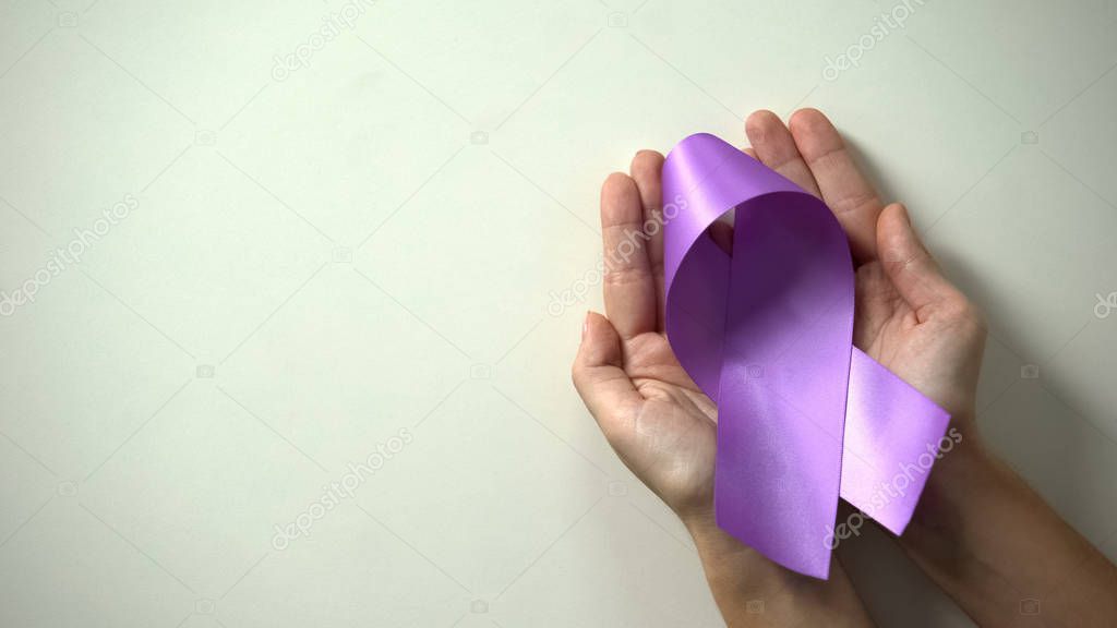Purple ribbon in lady hands, world Alzheimer disease awareness day, healthcare