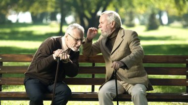 Senior gentlemen talking to his hearing impairment old friend, health problems clipart