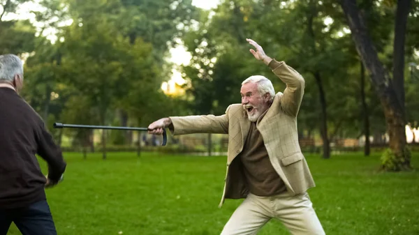 Mature Friends Having Fun Fighting Walking Sticks Pretending Knights — Stock Photo, Image