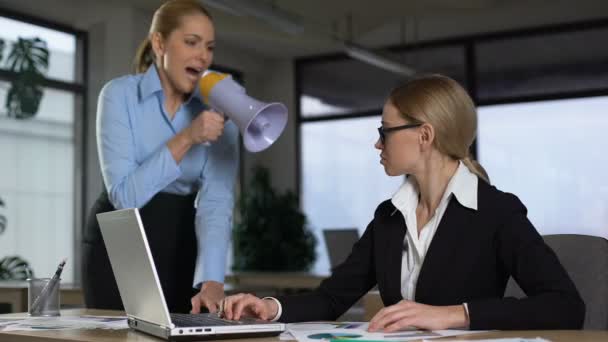Female boss screaming with megaphone at colleague, authoritarian leadership — Stock Video