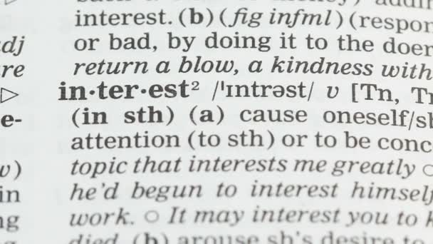 Interest, word definition in vocabulary, causing attention, business investment — Stock Video