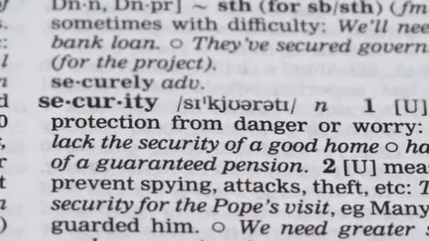 Security, pencil pointing word in dictionary, protection from danger, internet — Stock Video