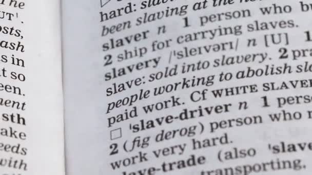 Slavery meaning in english vocabulary, using people labor under threat, abuse — Stock Video