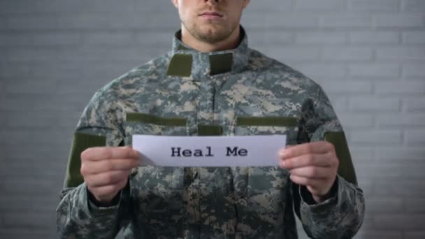 Heal me word written on sign in hands of male soldier, social security, rehab — Stock Video