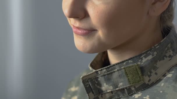 Young military woman smiling closeup dreaming of home, military occupation — 비디오