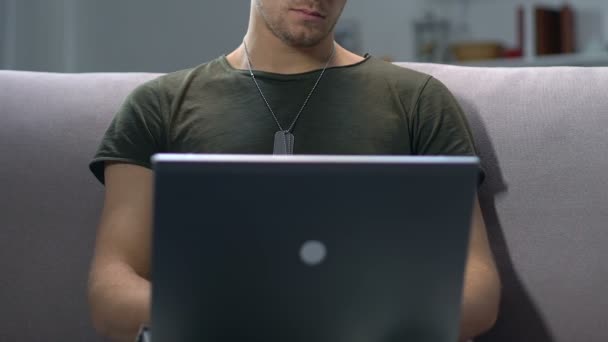 Young sergeant working laptop closeup, searching information online, application — Stock Video