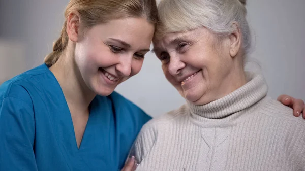 Medical Worker Hugging Supporting Smiling Elderly Lady Nursing Home — Stock Photo, Image