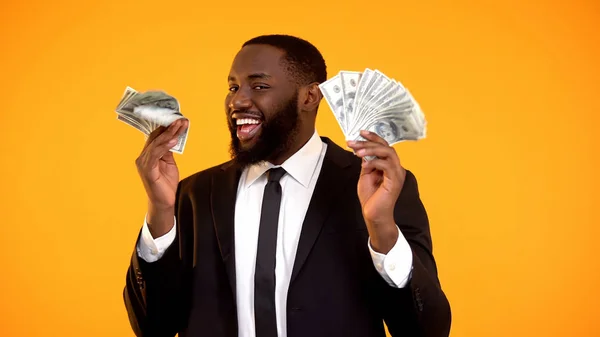 Successful Black Man Business Suit Holding Bunches Dollar Cash Smiling — Φωτογραφία Αρχείου