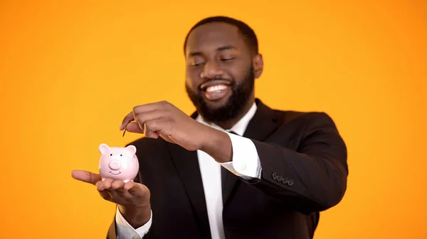 Smiling African American Businessman Suit Putting Coin Piggy Bank Deposit — Stock Photo, Image