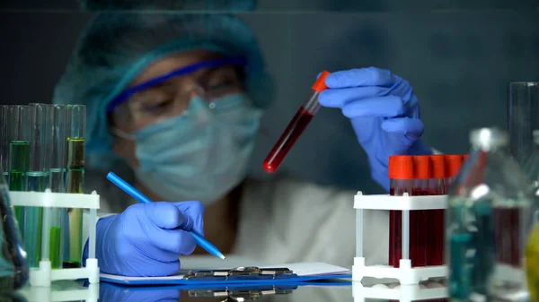 Scientist Checking Tube Blood Analysis Making Notes Epidemic Outbreak — Stock Photo, Image