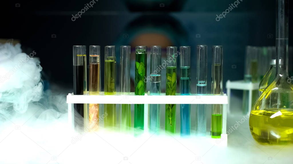 Tubes with different samples in refrigerator, cosmetological industry, extracts
