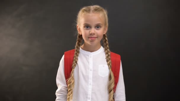 Funny schoolgirl showing wooden cubes with math word, exact sciences lesson — Stock Video