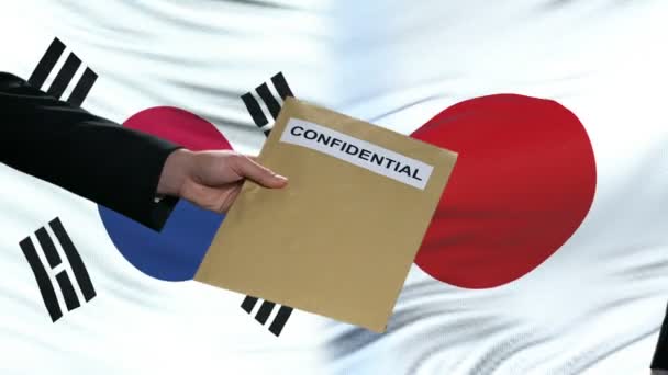 Corée du Sud et Japon échange d'enveloppes confidentielles contre des drapeaux — Video