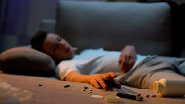 Drug Intoxicated Teenager Lying Sofa Taking Lighter Table Idle Life — Stock Photo, Image