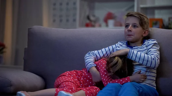 Brother Hugging Scared Sister While Watching Horror Film Together Night — Stock Photo, Image