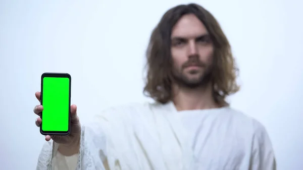 Άνθρωπος Όπως Ιησούς Κρατώντας Smartphone Πράσινη Οθόνη Κινητή Εφαρμογή Αγίας — Φωτογραφία Αρχείου