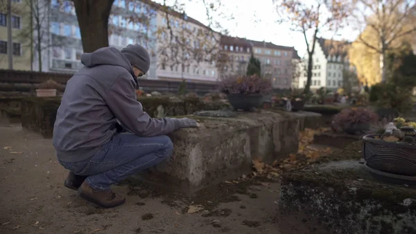 Young Man Sitting Grave Ancient Cemetery Praying Mourning Relatives — Stock Photo, Image