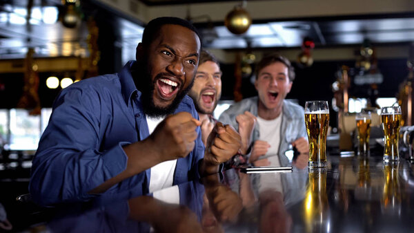 Extremely happy black sport game supporter happy about winning championship