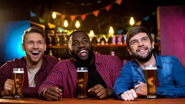 Multi Ethnic Friends Smiling Watching Comedy Show Big Screen Beer — Stock Photo, Image