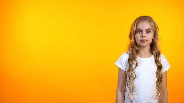 Beautiful Girl Looking Camera Isolated Orange Background Template — Stock Photo, Image
