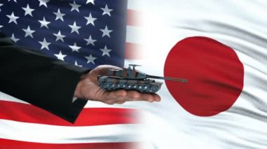 ABD ve Japonya yetkilileri para, bayrak arka plan, ortaklık için tank alışverişi