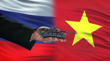Rusya ve Vietnam yetkilileri tank para, küresel silah, bayrak arka plan alışverişi