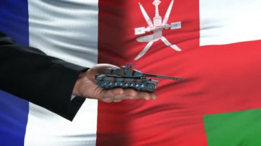 Fransa ve Umman yetkilileri para için tank alışverişi, bayrak arka plan müzakere