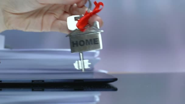 Home word on keychain in woman hand, purchase or long term rental of house — Stock Video