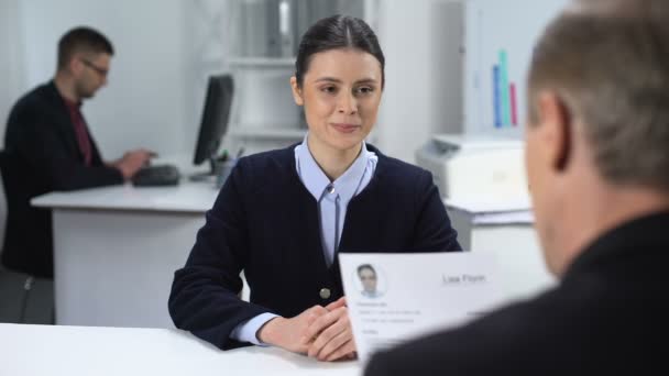 Company CEO looking through female candidate resume, shaking hands, hiring — Stock Video