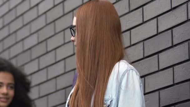 Biracial Teen Girl Pushing Classmate To Wall Outcast In High