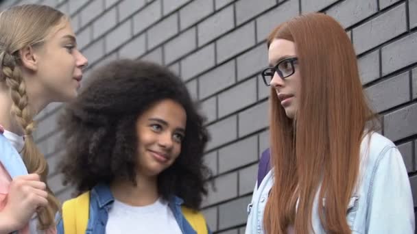 Ginger teenage girl depressed by threats, helpless before bullying classmates — Stock Video