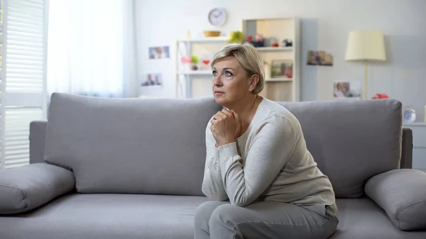 Depressed Mature Woman Praying Sitting Sofa Life Difficulties Crisis — Stock Photo, Image
