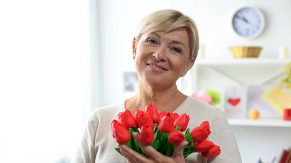 Happy Aged Female Holding Bouquet Tulips Admirer Smiling Camera — Stock Photo, Image